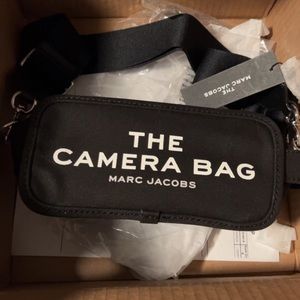 Marc Jacobs the camera bag. It’s brand new with tags never used.